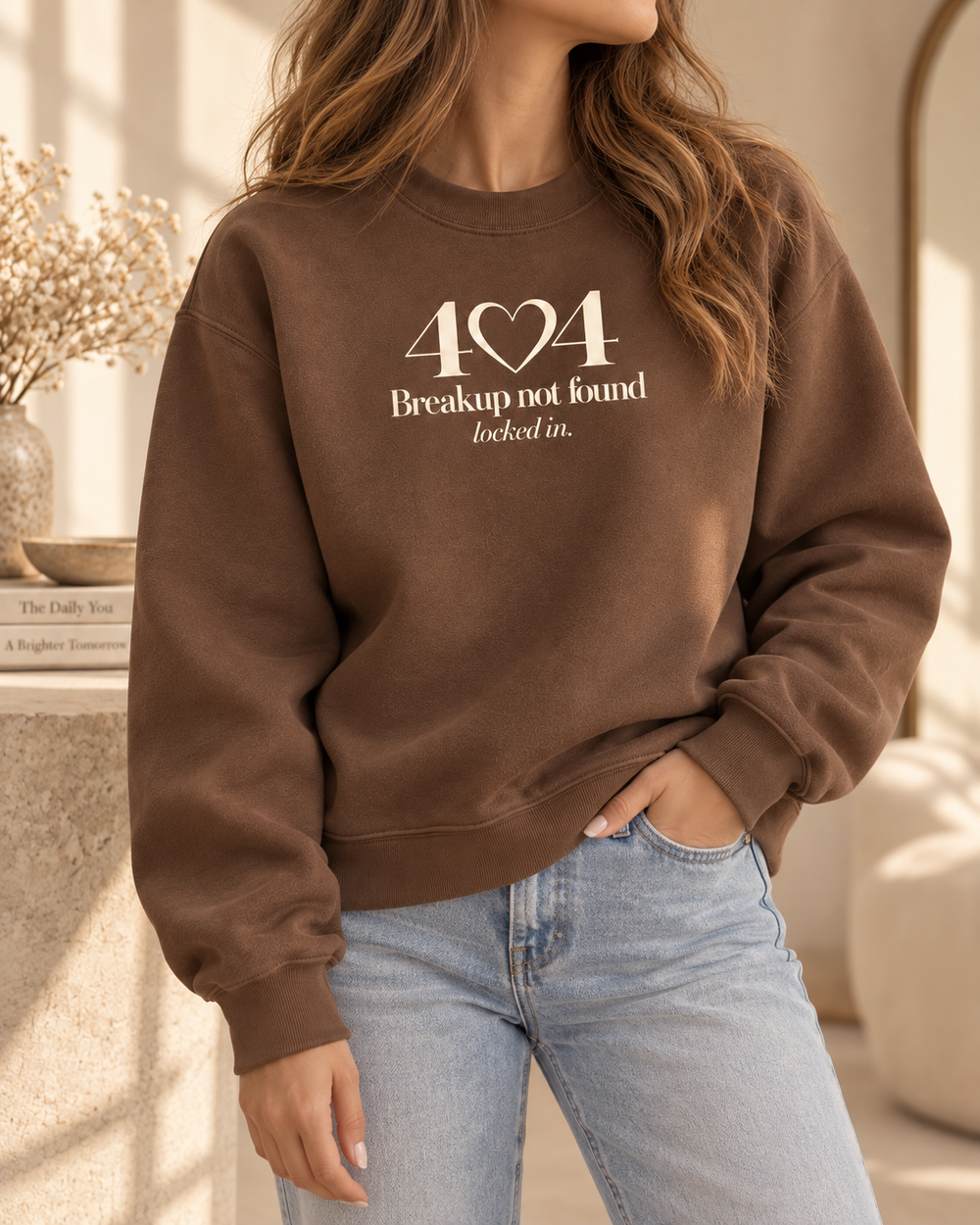 Faceless model styling the chestnut Lumiera 404 crewneck with denim