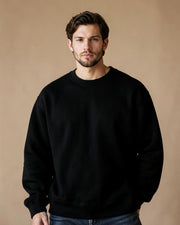 Model wearing the black Closer Than Yesterday crewneck