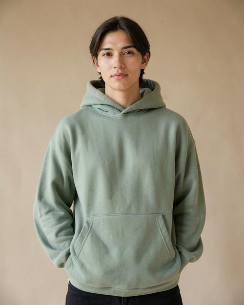 Model wearing the sage Locked In hoodie